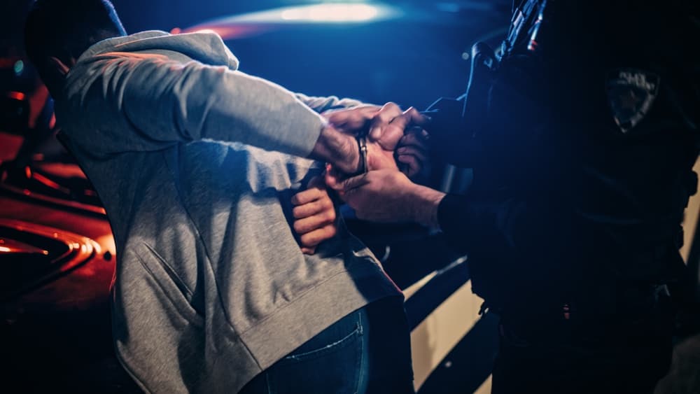 Police office arresting a persona for DWI charge